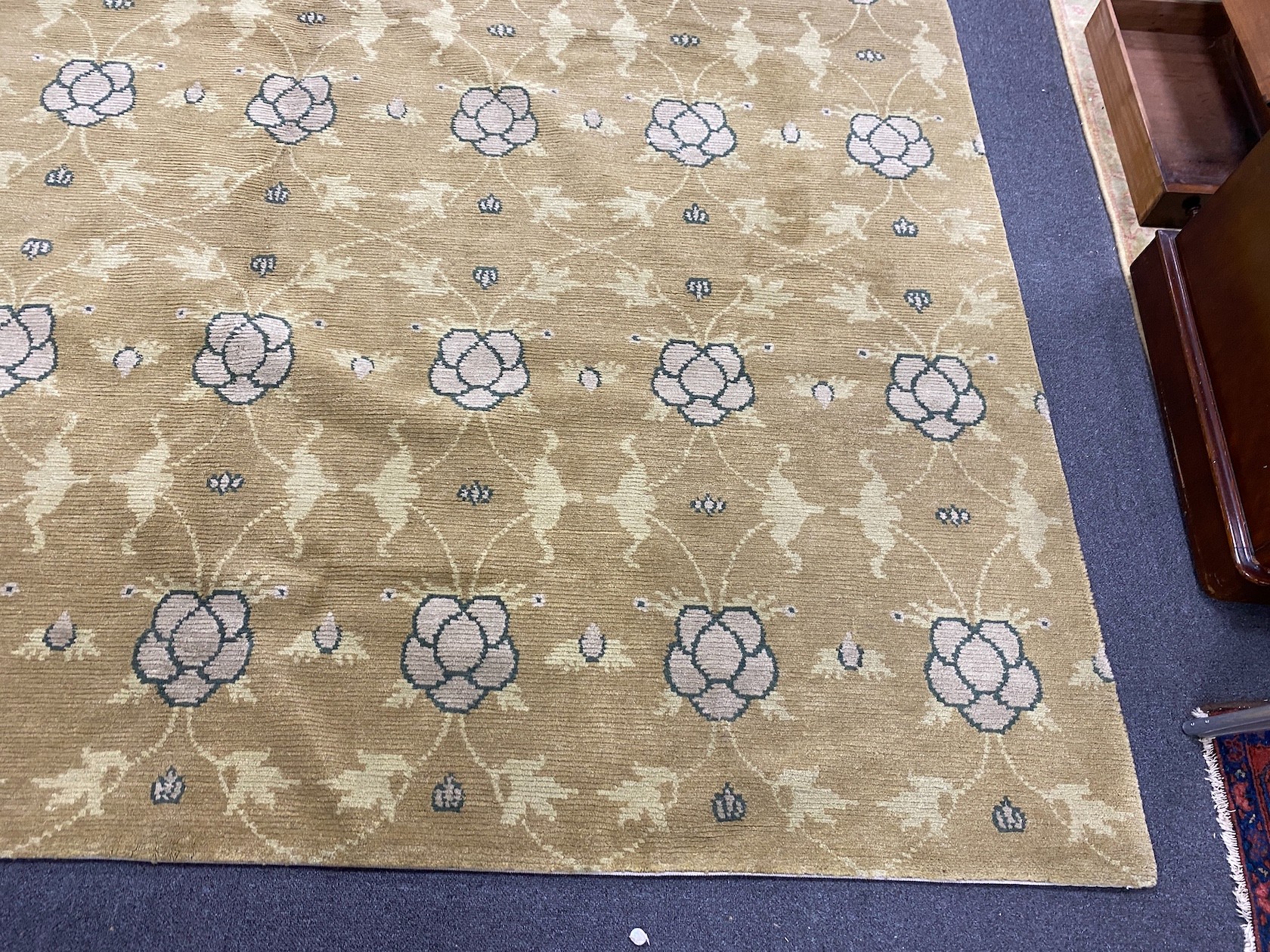 An Arts and Crafts style pale green ground carpet, 300 x 250cm